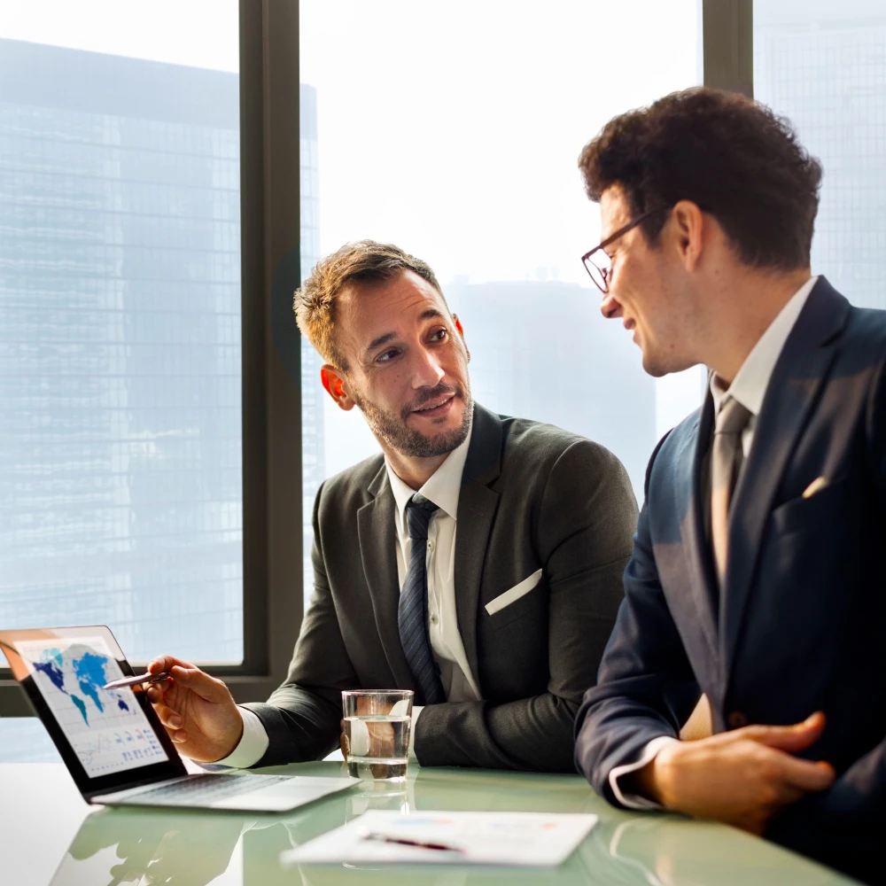 Progression Consultants Inc. Business Consultant advising client in modern Calgary office